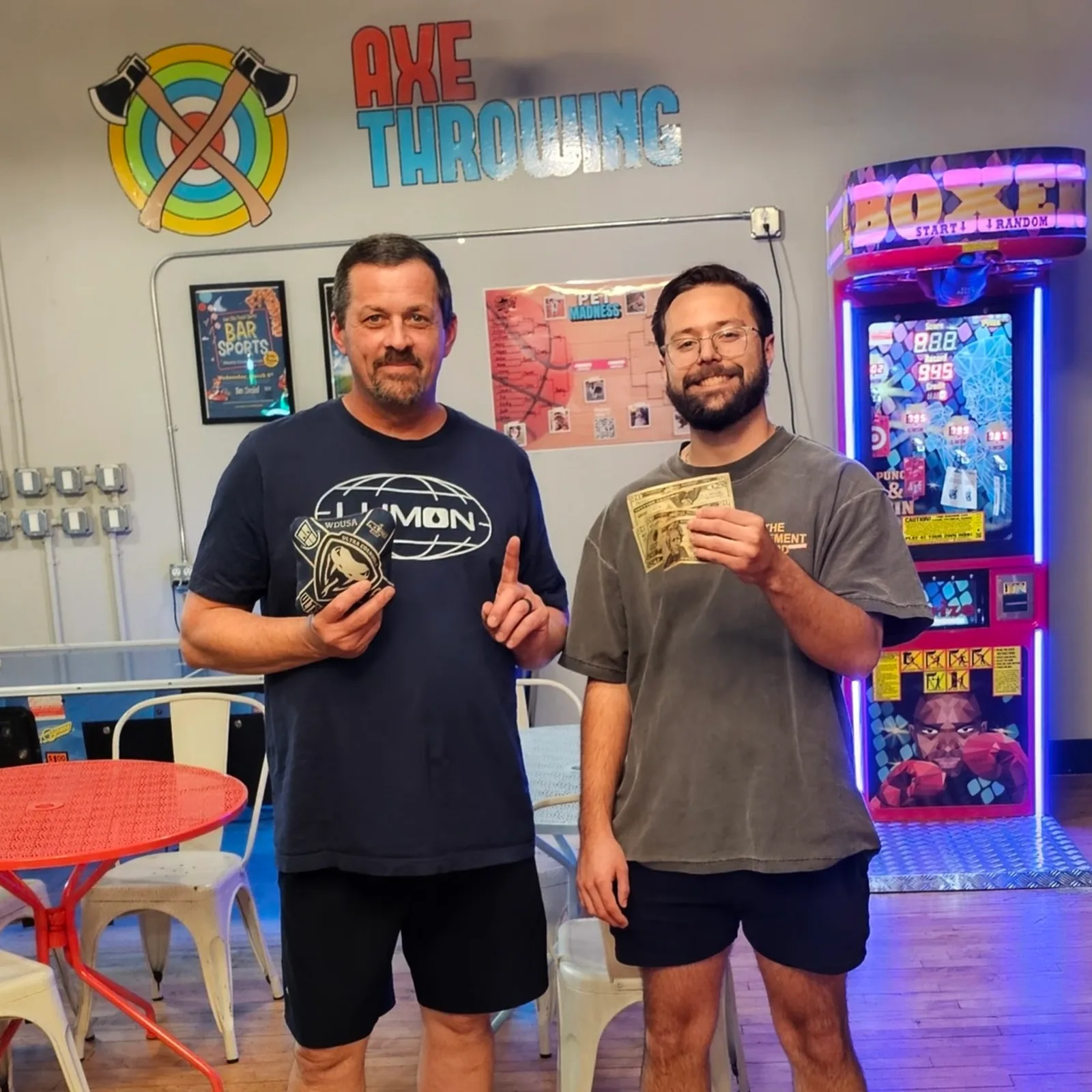 Two cornhole league winners celebrating at Two Social.