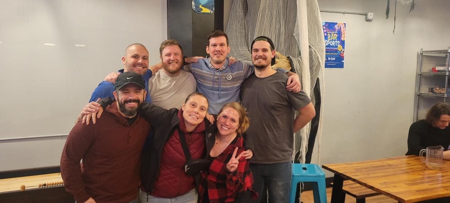 Friends playing bar games at Two Social