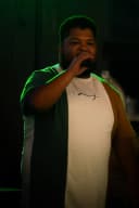 DJ Blake holding a microphone